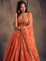 OnlyTrend Orange & Gold-Toned Embroidered Sequinned Shibori Semi-Stitched Lehenga & Unstitched Blouse With
